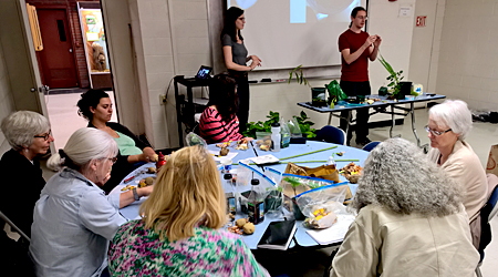 Students in 2017 Plant propagation class explain bulb propagation to Master Gardener volunteers.