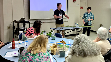 Students conducting 2016 Master Gardener lesson on budding and grafting.